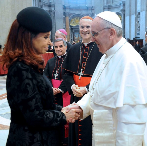 Argentine President Cristina Fernandez speaks to Pope Francis after his inauguration at the Vatican