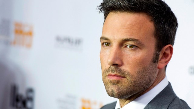 FILE - This Sept. 7, 2012 file photo shows actor and director Ben Affleck poseing for a photograph on the red carpet at the gala for the new movie "Argo" during the 37th annual Toronto International Film Festival in Toronto. Affleck is comparing US Republican presidential candidate Mitt Romney to past presidential hopefuls Al Gore, Michael Dukakis and Bob Dole.  But the actor and director, who has been outspoken in support of Democratic causes in the past, also doesn't offer full-throated support for President Barack Obama.  (AP Photo/The Canadian Press, Nathan Denette)