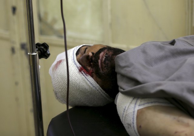 An Afghan man receives treatment at a hospital after a suicide truck bomb attack in Kabul, Afghanistan