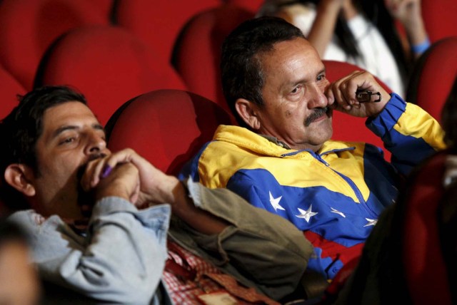 Supporters of Venezuela's President Nicolas Maduro react as National Electoral Council (CNE) President Tibisay Lucena announces the official results of parliamentary elections in Caracas, December 7, 2015. Venezuela's opposition won control of the legislature from the ruling Socialists for the first time in 16 years on Sunday, giving them a long-sought platform to challenge President Nicolas Maduro. REUTERS/Marco Bello FOR EDITORIAL USE ONLY. NO RESALES. NO ARCHIVE.