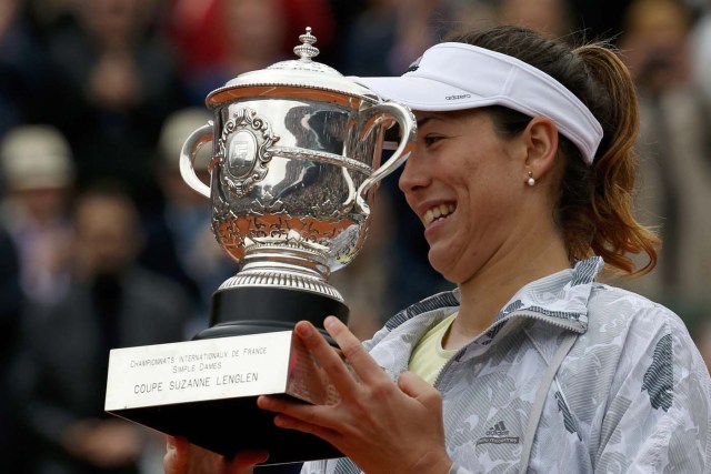 Tennis - French Open Women's Singles Final match - Roland Garros - Serena Williams of the U.S. vs  Garbine Muguruza of Spain- Paris, France - 04/06/16   Garbine Muguruza reacts with her trophy. REUTERS/Pascal Rossignol