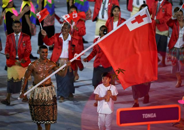 2016 Rio Olympics - Opening ceremony - Maracana - Rio de Janeiro, Brazil - 05/08/2016. Flagbearer Pita Nikolas Taufatofua (TGA) of Tonga leads his contingent during the opening ceremony. REUTERS/Dylan Martinez FOR EDITORIAL USE ONLY. NOT FOR SALE FOR MARKETING OR ADVERTISING CAMPAIGNS.