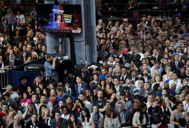 Supporters of Democratic U.S. presidential nominee Hillary Clinton watch election returns showing Donald Trump winning in Missouri at the election night rally in New York, U.S., November 8, 2016. REUTERS/Rick Wilking