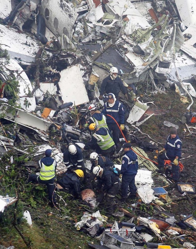 Rescue crew work in the wreckage from a plane that crashed into Colombian jungle with Brazilian soccer team Chapecoense, seen near Medellin, Colombia, November 29, 2016. REUTERS/Fredy Builes