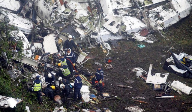 ATTENTION EDITORS - VISUAL COVERAGE OF SCENES OF INJURY OR DEATHRescue crew work in the wreckage from a plane that crashed into Colombian jungle with Brazilian soccer team Chapecoense, seen near Medellin, Colombia, November 29, 2016. REUTERS/Fredy Builes TEMPLATE OUT