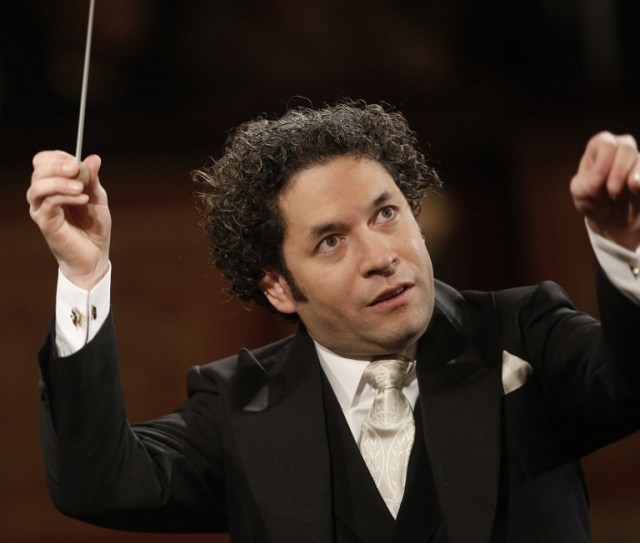 Venezulean conductor Gustavo Dudamel conducts the traditional New Year's Concert 2017 with the Vienna Philharmonic Orchestra at the Vienna Musikverein in Vienna, Austria, on January 1, 2017. / AFP PHOTO / Dieter Nagl