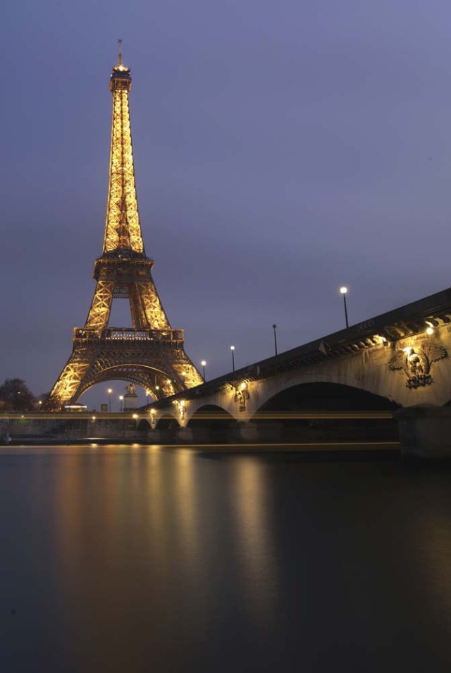 Streaks of lights from a tour boat are seen in this long time-exposure of the illuminated Eiffel Tower and the Seine River in Paris, France, January 17, 2017. REUTERS/Philippe Wojazer