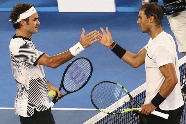 Tennis - Australian Open - Melbourne Park, Melbourne, Australia - 29/1/17 Switzerland's Roger Federer shakes hands after winning his Men's singles final match against Spain's Rafael Nadal. REUTERS/David Gray