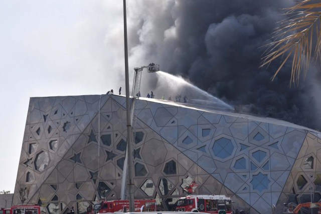 Firefighters work to contain a large fire at Jaber Al Ahmad Cultural Centre in Kuwait City, Kuwait February 6, 2017. REUTERS/Stephanie McGehee