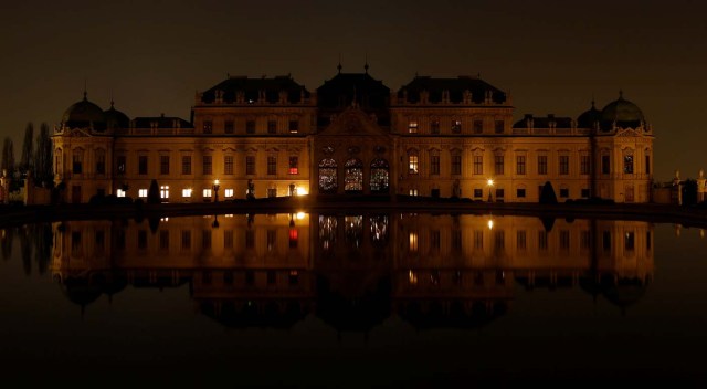 Belvedere palace and its reflection in a pond are seen after the lights were switched off for Earth Hour in Vienna, Austria, March 25, 2017. REUTERS/Heinz-Peter Bader