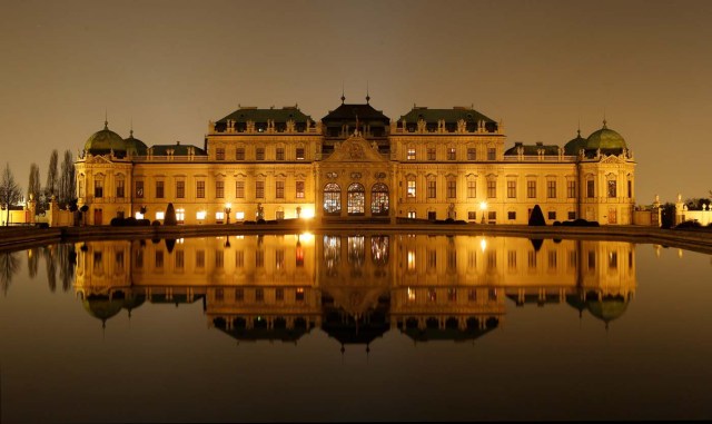 A long exposure shows Belvedere palace and its reflection in a pond after the lights were switched off for Earth Hour in Vienna, Austria, March 25, 2017. REUTERS/Heinz-Peter Bader