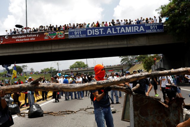 Demonstrators build barricades during a rally against Venezuela's President Nicolas Maduro in Caracas