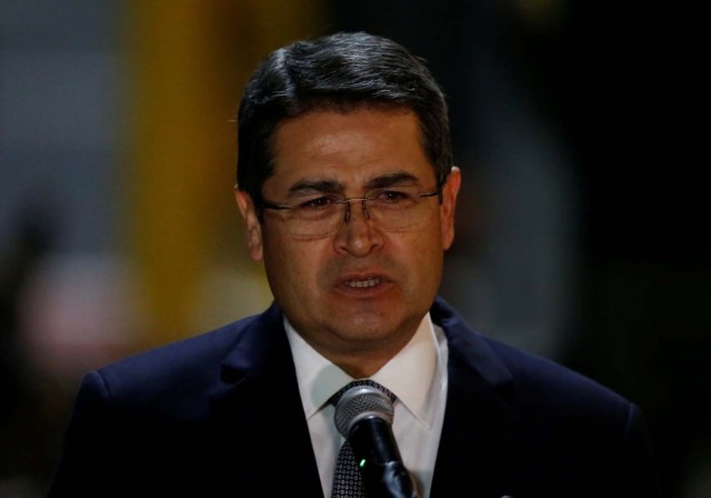 Honduras' President Juan Orlando Hernandez speaks to the media after his arrival at Mariscal Sucre Airport in Quito, Ecuador May 23, 2017 ahead of Ecuadorean president inauguration. REUTERS/Henry Romero