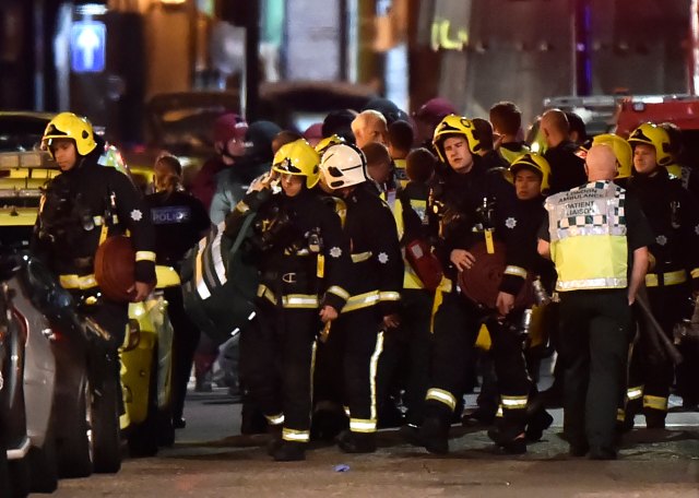 Rescue personnel assemble after an incident near London Bridge in London, Britain June 4, 2017. REUTERS/Hannah Mckay
