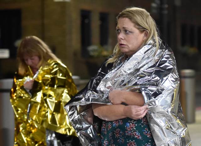 People leave the area wearing foil blankets after an incident near London Bridge in London, Britain June 4, 2017. REUTERS/Hannah Mckay TPX IMAGES OF THE DAY