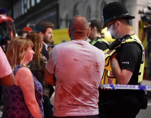 People speak with police officers after an incident near London Bridge in London, Britain June 4, 2017. REUTERS/Hannah Mckay