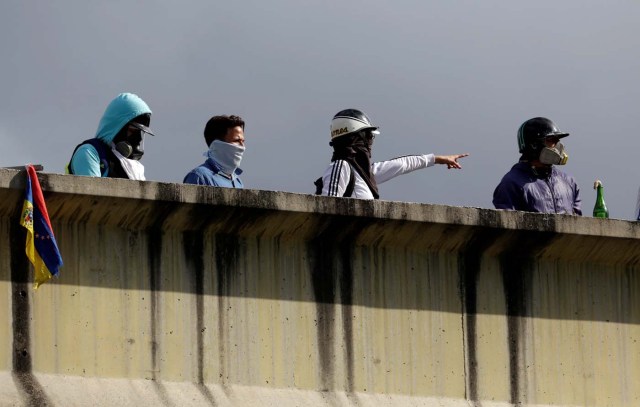 Masked demonstrators are seen during clashes with security forces at a rally against Venezuelan President Nicolas Maduro's government in Caracas, Venezuela, July 6, 2017. REUTERS/Marco Bello