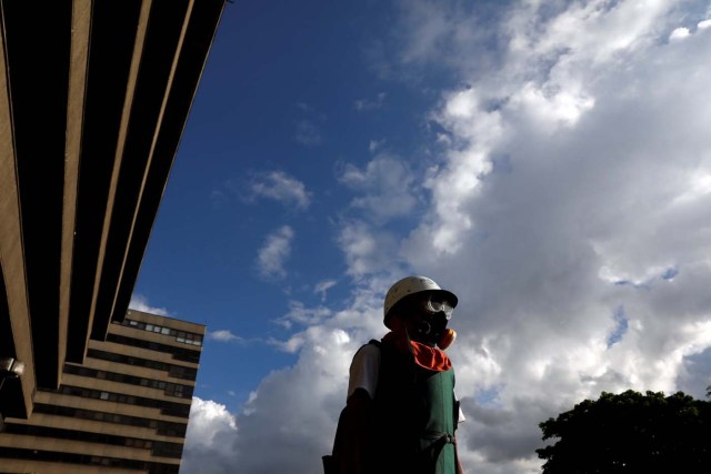 A demonstrator stands during clashes with security forces at a rally against Venezuelan President Nicolas Maduro's government in Caracas, Venezuela, July 6, 2017. REUTERS/Andres Martinez Casares