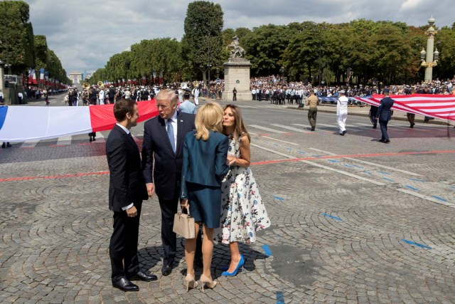 U.S. President Donald Trump (2ndL) and First Lady Melania Trump bid adieu after viewing France's Bastille Day military parade on the Champs-Elysees as the guests of French President Emmanuel Macron (L) and his wife Brigitte Macron, in Paris, France, July 14, 2017. REUTERS/Stephen Crowley/Pool