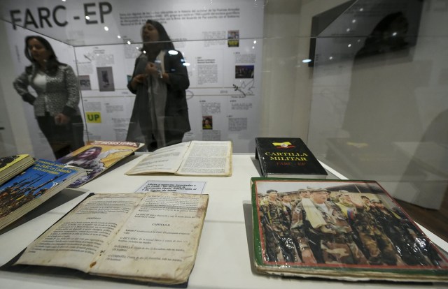 Books belonging to members of Revolutionary Armed Forces of Colombia (FARC) seized by the Colombian army during the Fenix operation March 1, 2008, are on display during the opening of Colombia's General Prosecutor's Office museum in Bogota, on July 7, 2017. The museum was inaugurated within the framework of the 25th anniversary of the General Prosecutor's Office and aims to bring to the public to objects seized in judicial processes in the country. / AFP PHOTO / Raul Arboleda