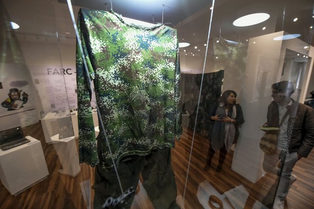 Fatigues who belonged to Revolutionary Armed Forces of Colombia (FARC) late commander Jorge Briceno,aka "Mono Jojoy", killed by the Colombian army during the Sodoma operation in September 22, 2010, are on display during the opening of Colombia's General Prosecutor's Office museum in Bogota, on July 7, 2017. The museum was inaugurated within the framework of the 25th anniversary of the General Prosecutor's Office and aims to bring to the public to objects seized in judicial processes in the country. / AFP PHOTO / Raul Arboleda