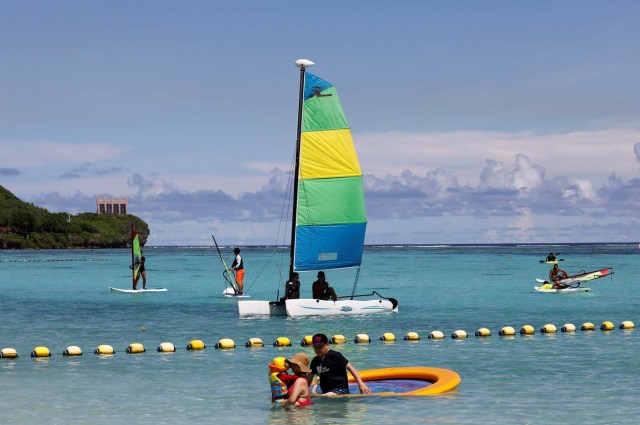 Tourists are pictured on the waters off Tumon beach on the island of Guam, a U.S. Pacific Territory, August 11, 2017. REUTERS/Erik De Castro