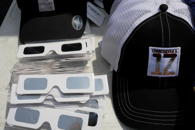 Solar viewing glasses and baseball caps are for sale in Carbondale, Illinois, U.S., August 20, 2017, one day before the total solar eclipse. REUTERS/Brian Snyder NO RESALES. NO ARCHIVES.