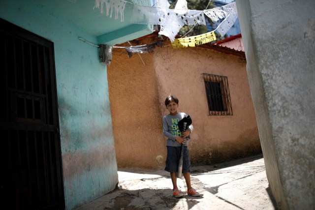 Aiberth Tovar, 7, poses for a photo close his house in Caracas, Venezuela August 30, 2017. Picture taken August 30, 2017. REUTERS/Carlos Garcia Rawlins