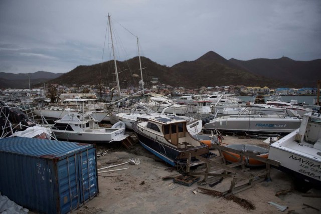 General view of wrecked boats in Geminga shipyard in Marigot, taken on September 9, 2017 in Saint-Martin island devastated by Irma hurricane. Officials on the island of Guadeloupe, where French aid efforts are being coordinated, suspended boat crossings to the hardest-hit territories of St. Martin and St. Barts where 11 people have died. Two days after Hurricane Irma swept over the eastern Caribbean, killing at least 17 people and devastating thousands of homes, some islands braced for a second battering from Hurricane Jose this weekend. / AFP PHOTO / Martin BUREAU