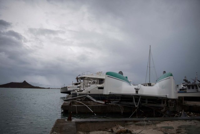 General view of wrecked boats in Geminga shipyard in Marigot, taken on September 9, 2017 in Saint-Martin island devastated by Irma hurricane. Officials on the island of Guadeloupe, where French aid efforts are being coordinated, suspended boat crossings to the hardest-hit territories of St. Martin and St. Barts where 11 people have died. Two days after Hurricane Irma swept over the eastern Caribbean, killing at least 17 people and devastating thousands of homes, some islands braced for a second battering from Hurricane Jose this weekend. / AFP PHOTO / Martin BUREAU