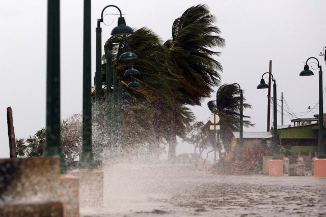 Winds lash the coastal city of Fajardo as Hurricane Maria approaches Puerto Rico, on September 19, 2017.  Maria headed towards the Virgin Islands and Puerto Rico after battering the eastern Caribbean island of Dominica, with the US National Hurricane Center warning of a "potentially catastrophic" impact. / AFP PHOTO / Ricardo ARDUENGO