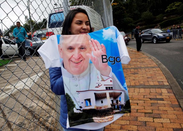 A woman sells a shirt with an image of Pope Francis along a street in Bogota, Colombia September 3, 2017. REUTERS/Henry Romero NO RESALES. NO ARCHIVES