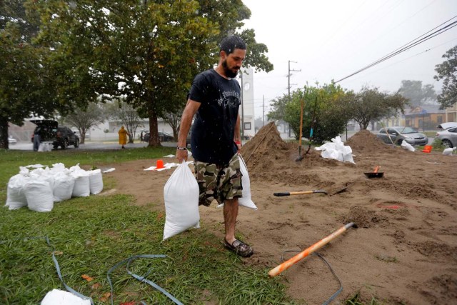 A resident fills sand bags as the he prepares for Hurricane Nate in New Orleans, Louisiana, U.S. on October 7, 2017. REUTERS/Jonathan Bachman