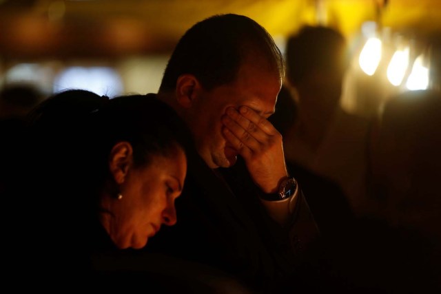 People react during a silent candlelight vigil to protest against the assassination of investigative journalist Daphne Caruana Galizia in a car bomb attack, in St Julian's, Malta, October 16, 2017.  REUTERS/Darrin Zammit Lupi