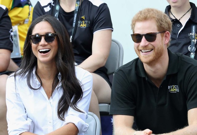 (FILES) This file photo taken on September 25, 2017 shows Britain's Prince Harry (R) and Meghan Markle (L) attend a Wheelchair Tennis match during the Invictus Games 2017 at Nathan Philips Square on September 25, 2017 in Toronto, Canada. Britain's Prince Harry will marry his US actress girlfriend Meghan Markle early next year after the couple became engaged earlier this month, Clarence House announced on November 27, 2017. / AFP PHOTO / GETTY IMAGES NORTH AMERICA / Chris Jackson