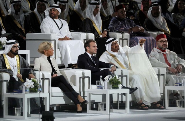 French President Emmanuel Macron (C-R) and his wife Brigitte Macron (C-L) speak with Abu Dhabi Crown Prince Mohammed bin Zayed al-Nahyan and Ruler of Dubai Sheikh Mohammed bin Rashid al-Maktoum during the inauguration of the Louvre Abu Dhabi Museum in Abu Dhabi, UAE, November 8, 2017. Picture taken November 8, 2017. REUTERS/Ludovic Marin/Pool