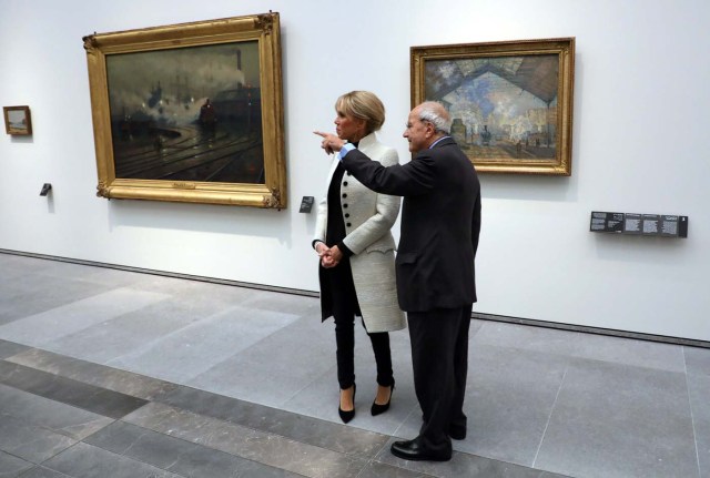 Brigitte Macron the wife of the French president speaks with an official as she visits the Louvre Abu Dhabi Museum during its inauguration in Abu Dhabi, UAE, November 8, 2017. Picture taken November 8, 2017. REUTERS/Ludovic Marin/Pool