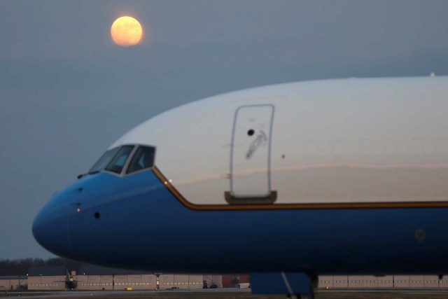 The moon is seen above the Air Force One plane at Joint Base Andrews in Maryland, U.S., after U.S. President Donald Trump returned to Washington from New York, December 2, 2017. REUTERS/Yuri Gripas
