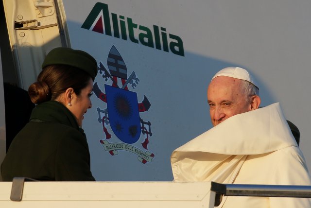 Pope Francis looks on as he boards for his trip to Chile and Peru at Fiumicino International Airport in Rome, Italy, January 15, 2018. REUTERS/Max Rossi