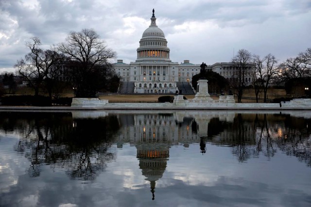 Clouds pass over the U.S. Capitol at the start of the third day of a shut down of the federal government in Washington, U.S., January 22, 2018. REUTERS/Joshua Roberts