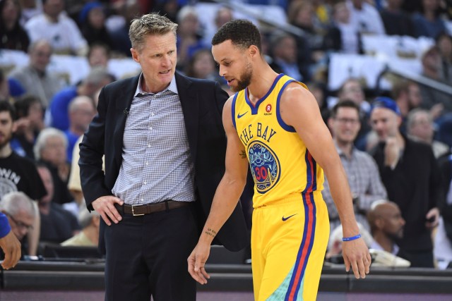 March 8, 2018; Oakland, CA, USA; Golden State Warriors head coach Steve Kerr (left) talks to guard Stephen Curry (30) after an injury against the San Antonio Spurs during the first quarter at Oracle Arena. Mandatory Credit: Kyle Terada-USA TODAY Sports