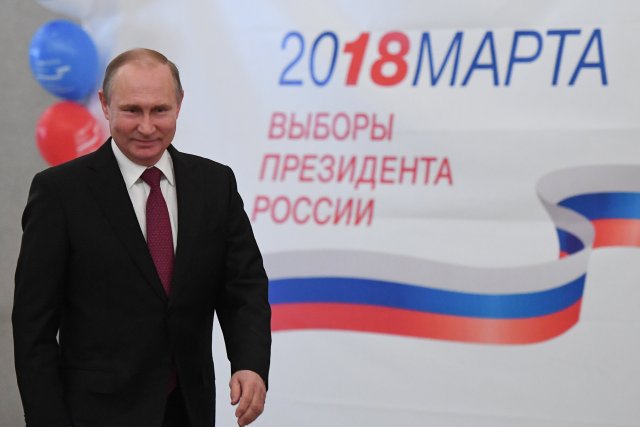 Russian President and Presidential candidate Vladimir Putin at a polling station during the presidential election in Moscow, Russia March 18, 2018. Yuri Kadobnov/POOL via Reuters
