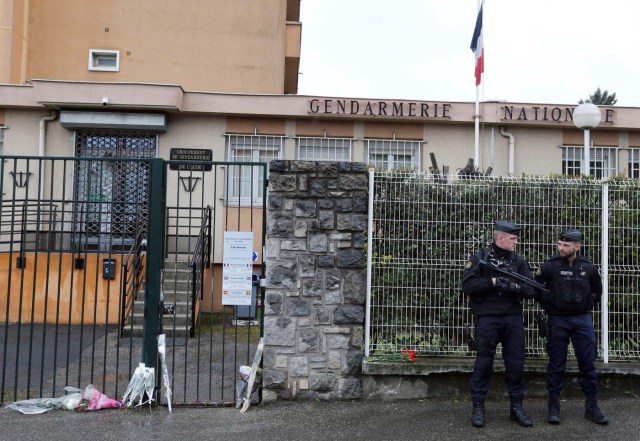 Flowers and messages in tribute to the victim are seen in front of the Gendarmerie of Carcassonne, the day after a hostage situation in Trebes, France March 24, 2018. REUTERS/Regis Duvignau