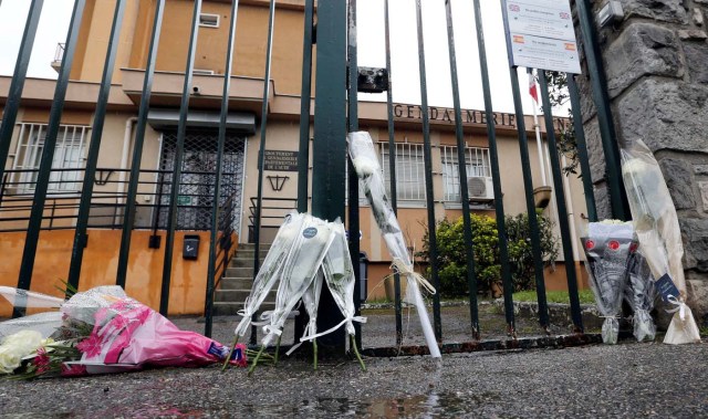 Flowers and messages in tribute to the victim are seen in front of the Gendarmerie of Carcassonne, the day after a hostage situation in Trebes, France March 24, 2018. REUTERS/Regis Duvignau