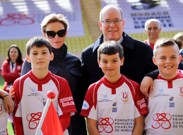 Princess Charlene of Monaco and Prince Albert II of Monaco attend the International Rugby tournament Tournoi Sainte Devote at the Louis II Stadium in Monaco, March 31, 2018. Valery Hache/Pool via Reuters