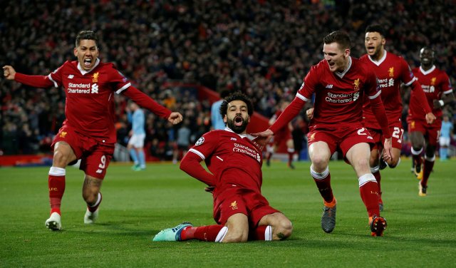 Soccer Football - Champions League Quarter Final First Leg - Liverpool vs Manchester City - Anfield, Liverpool, Britain - April 4, 2018   Liverpool's Mohamed Salah celebrates with Roberto Firmino and Andrew Robertson after scoring their first goal    REUTERS/Andrew Yates     TPX IMAGES OF THE DAY