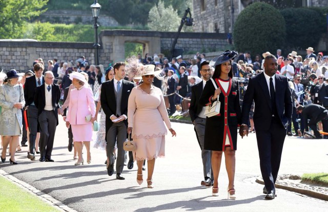 Idris Elba and Sabrina Dhowre followed by Oprah Winfrey (fourth right) arrive at St George's Chapel at Windsor Castle for the wedding of Meghan Markle and Prince Harry. Saturday May 19, 2018. Chris Radburn/Pool via REUTERS